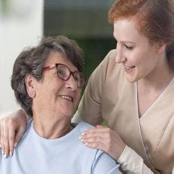 Aid comforting woman